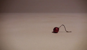 Small Christmas decoration crawling along - still from stop frame animation