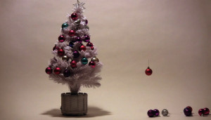 Christmas tree decorations flying up onto tree - still from stop frame animation by Toop Studio