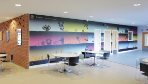 Wellington Academy Science wall showing the scale of an atom to a planet