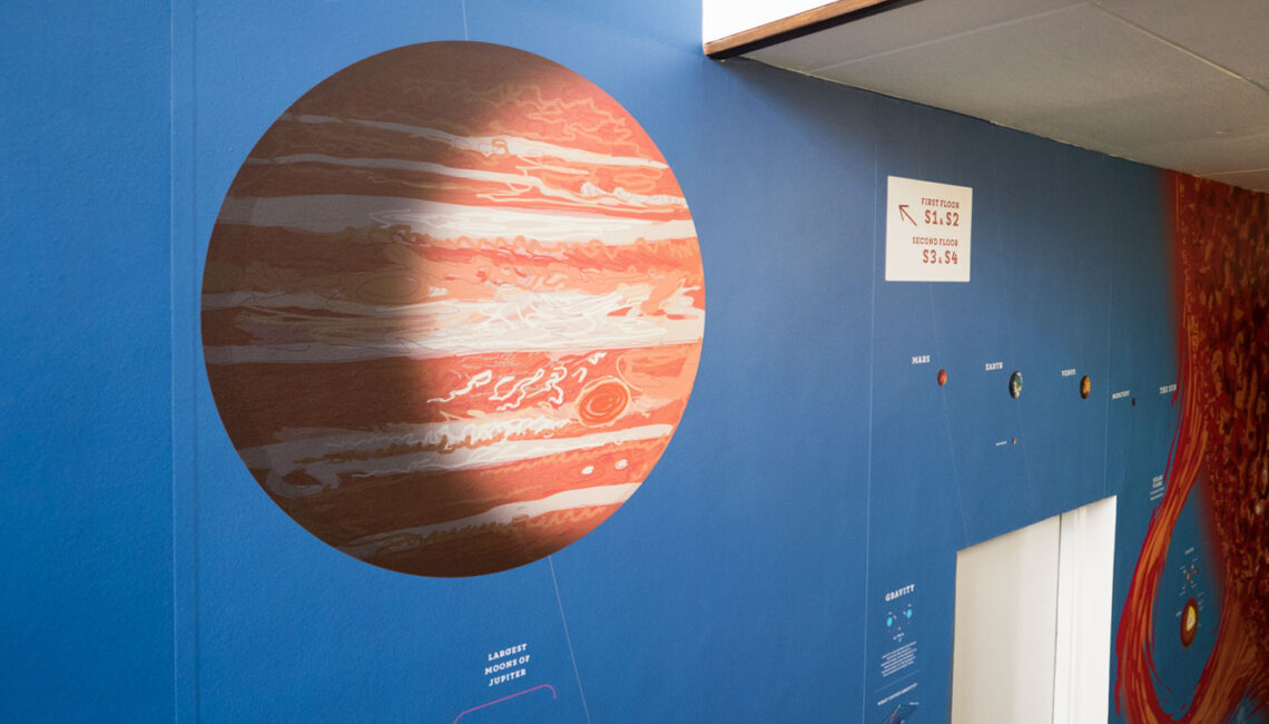 Toop Studio wall graphic showing jupiter