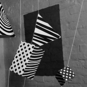 Patterns in Motion - Black and White patterned cuboids hanging in space - set for an ident video - Shadric Toop