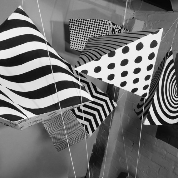 Patterns in Motion - Black and White patterned cuboids hanging in space - set for an ident video - Shadric Toop