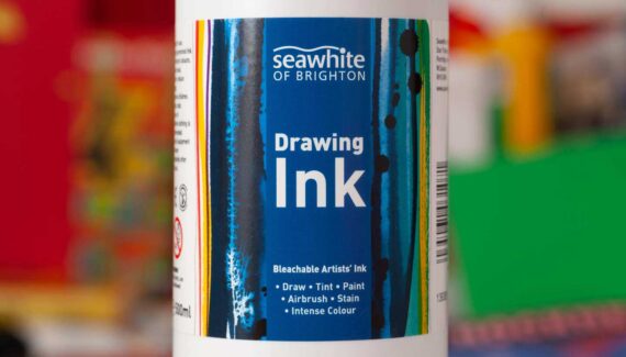 Seawhite Art Materials - Drawing Ink Label Design with a blue central panel and coloured ink painted on the sides - Toop Studio